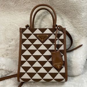 Prada Symbole embroidered fabric mini bag. Authentic code can be provided.